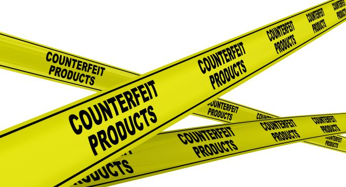 Yellow tape printed with word counterfeit